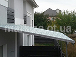 Солнцезащитная конструкция для террасы дома
